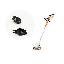 Akumulátorový elektrický vyžínač trávy značky STIHL s nabíječkou a výměnnou baterií.